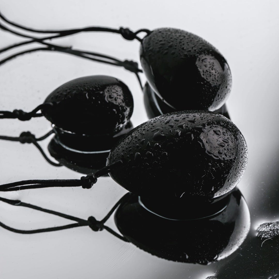 Kegel yoni egg set of 3 lying down white background